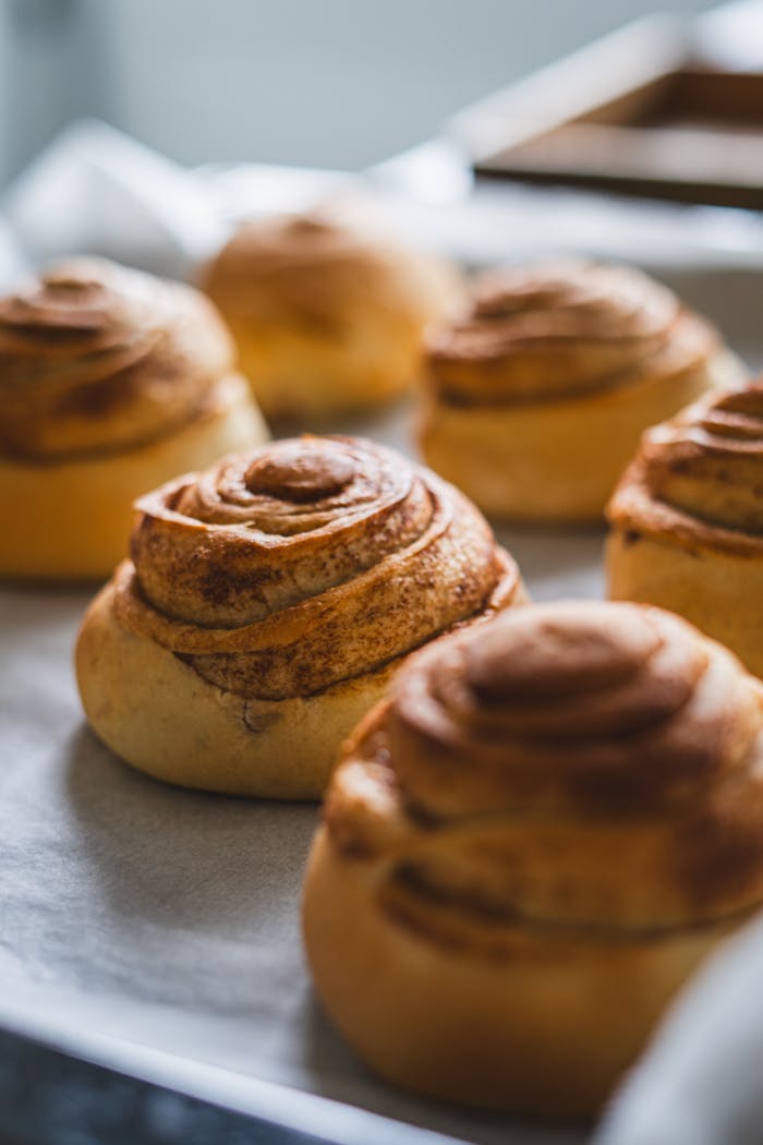 Close-up of warm cinnamon rolls, perfect for bakery themes.
